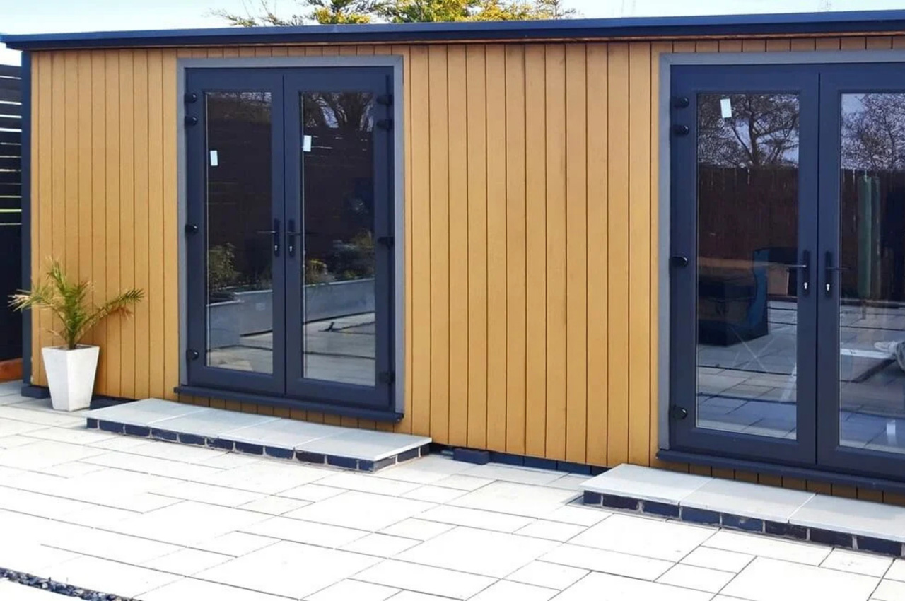 Contemporary garden building features vertical Composite Wall Cladding in Teak