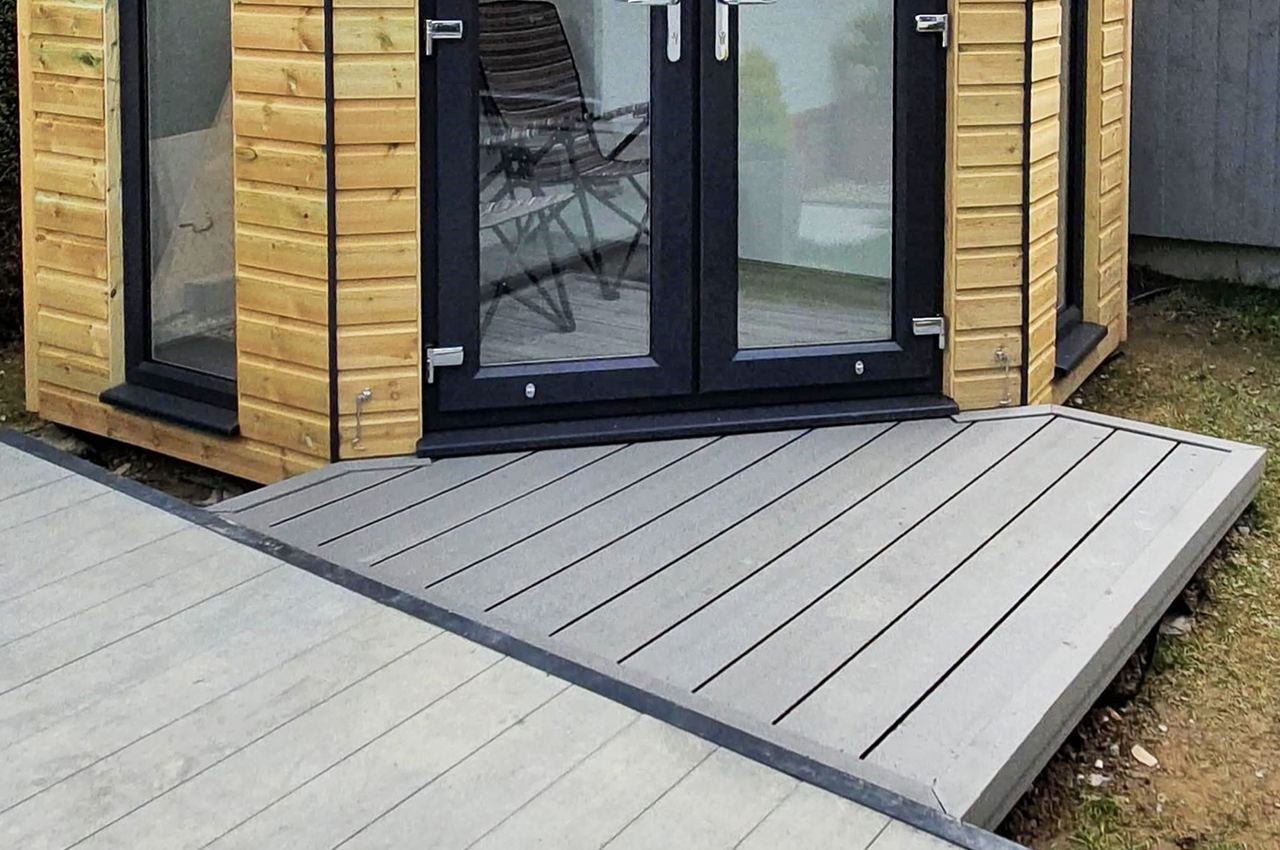 The entrance to this garden room was designed using Cladco Decking® in Stone Grey 