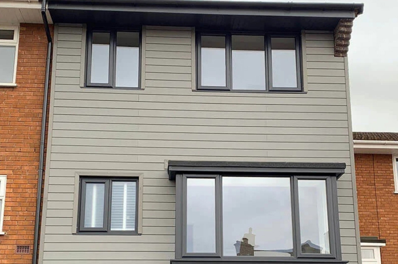 Cladco Stone Grey Composite Wall Cladding Boards modernise an existing semi-detached home.