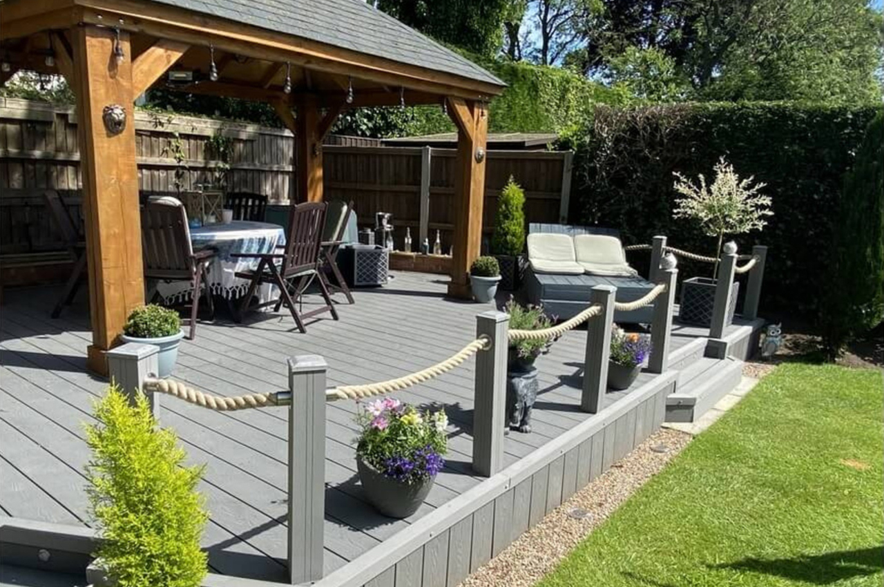 Composite Woodgrain Decking creates an attractive, low-maintenance, high-quality outdoor seating and eating area.