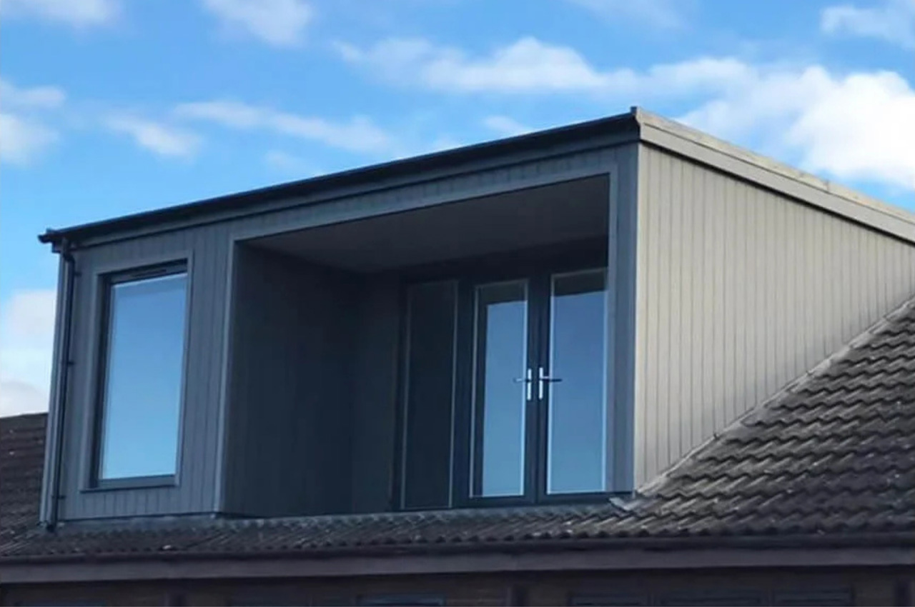 A contemporary dormer window extension uses Cladco Composite Wall Cladding
