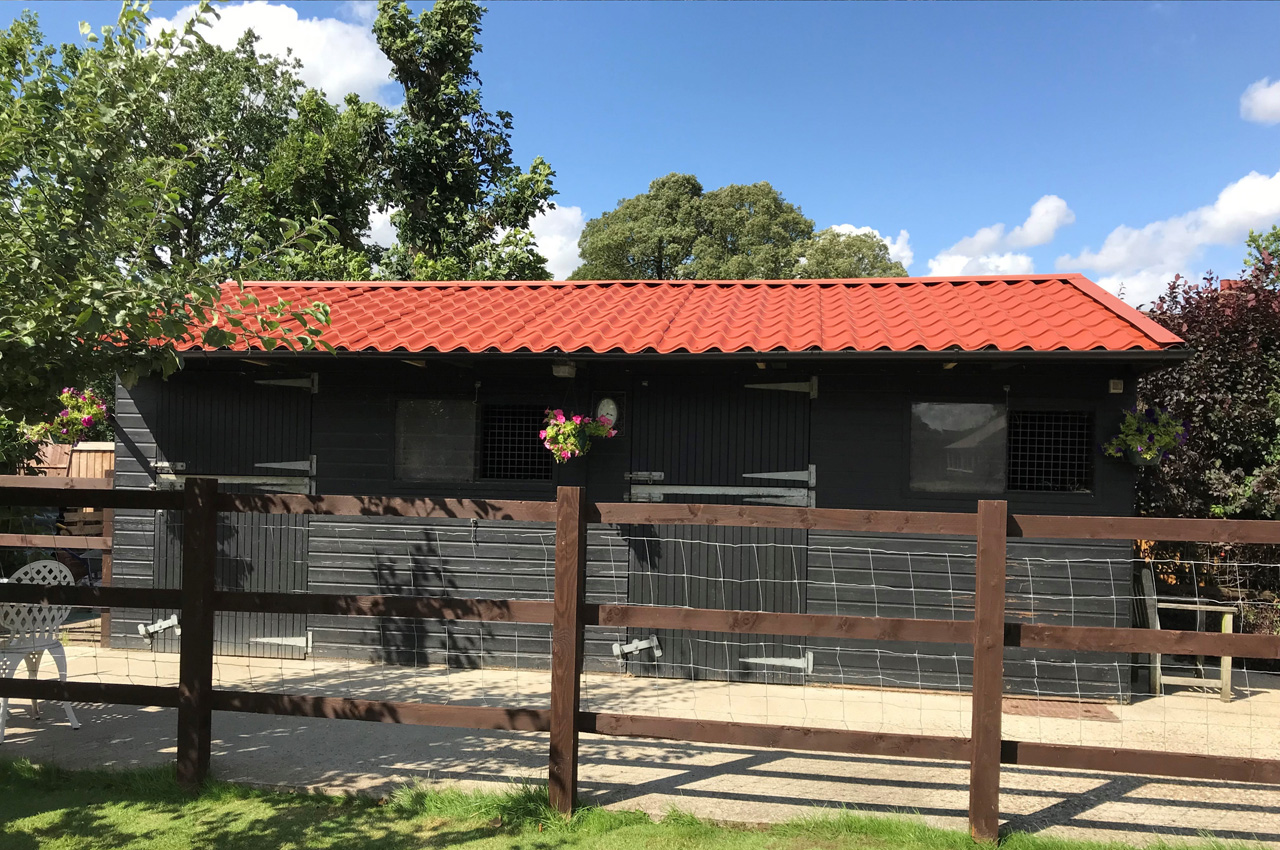 Copper Brown Tileform Sheeting on garden shed.