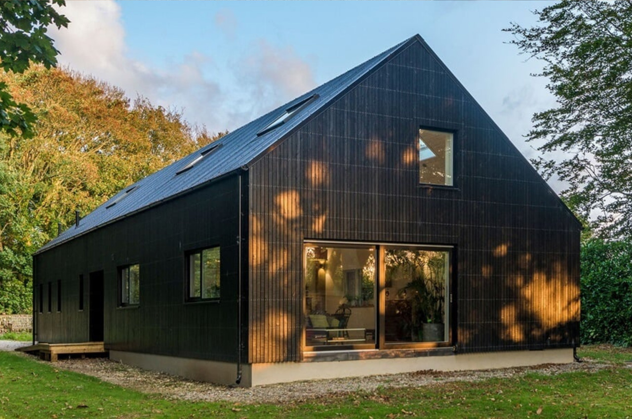 Cladco Corrugated Roofing Sheets in Black feature on this family home