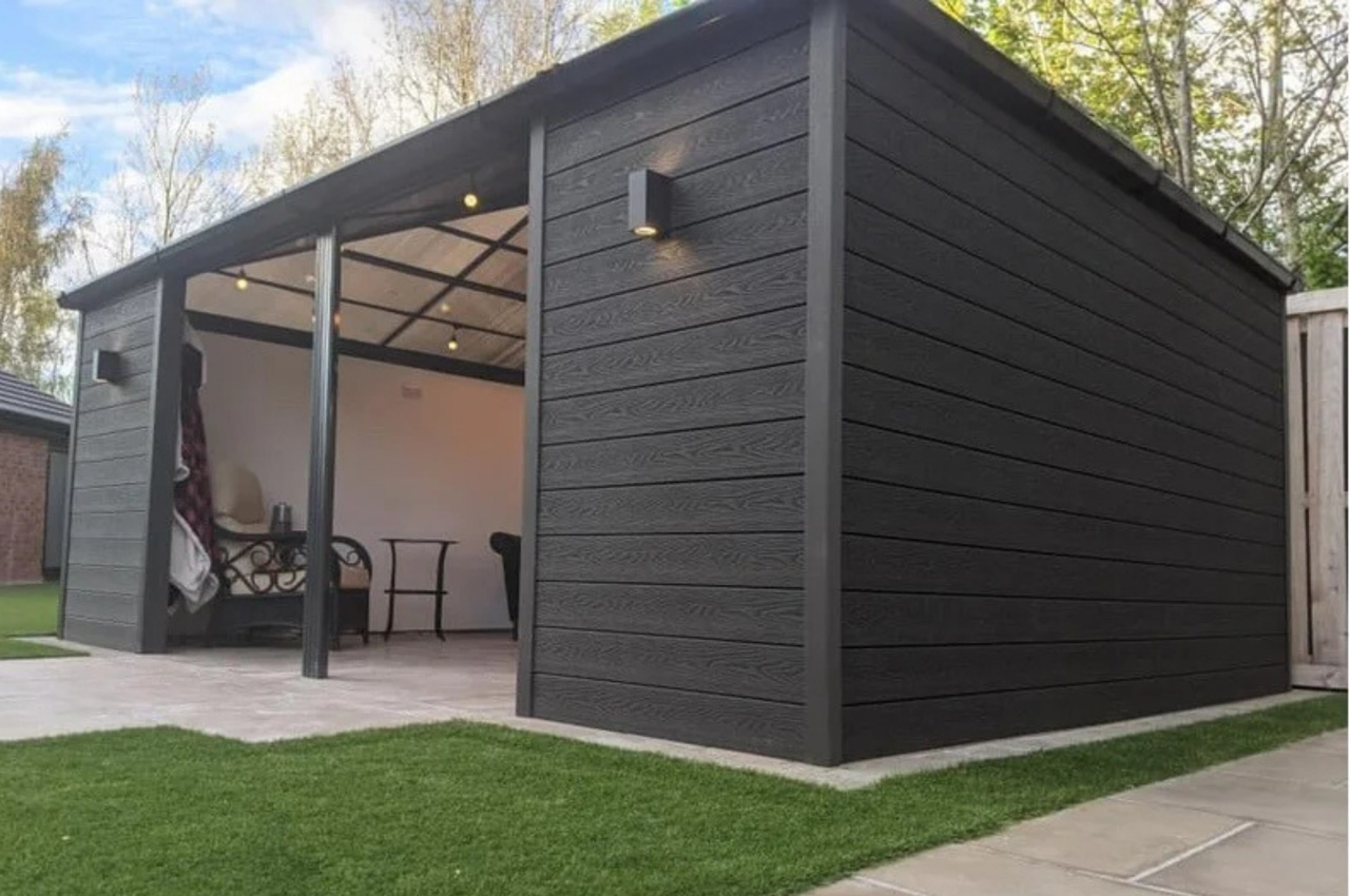 Attractive summer house clad in a sophisticated and contemporary Charcoal Woodgrain Composite Wall Cladding 