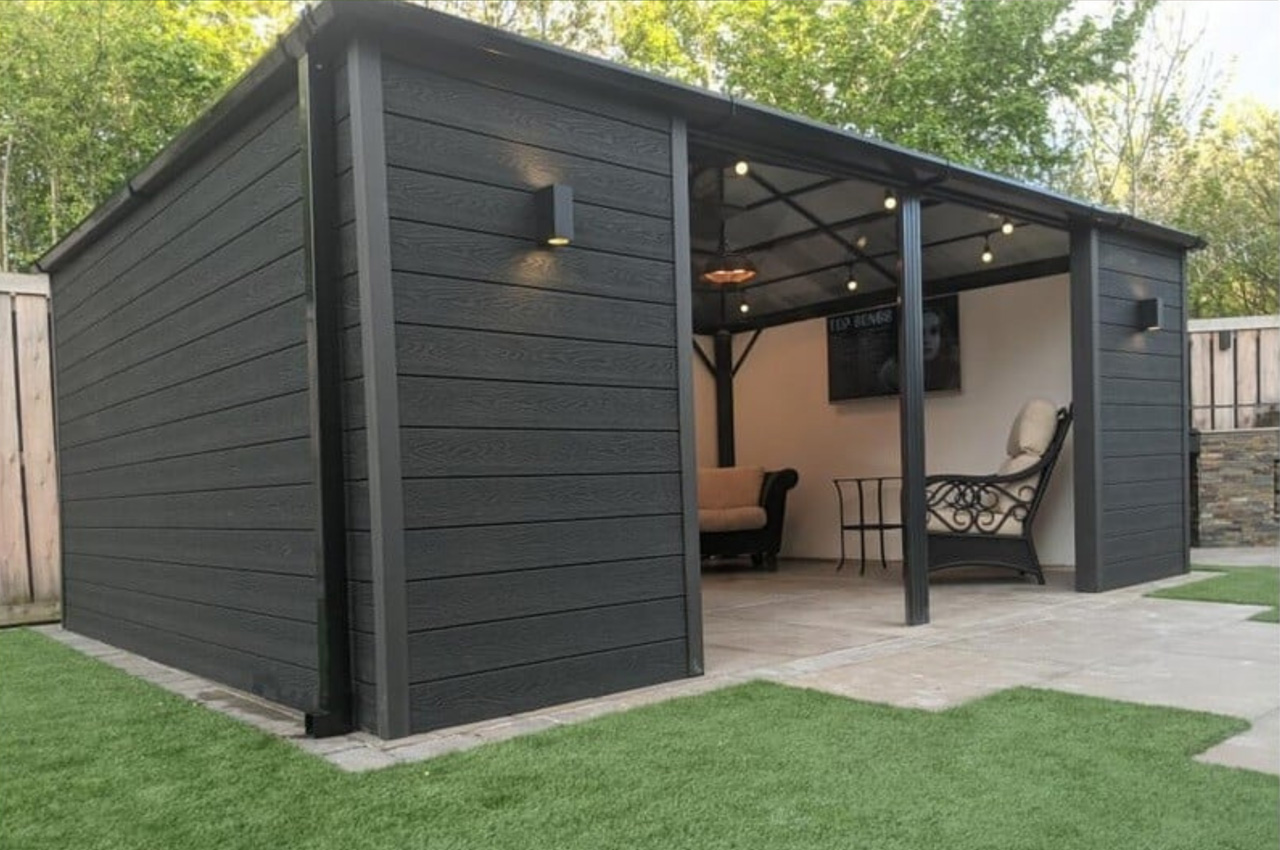 Attractive summer house clad in a sophisticated and contemporary Charcoal Woodgrain Composite Wall Cladding 