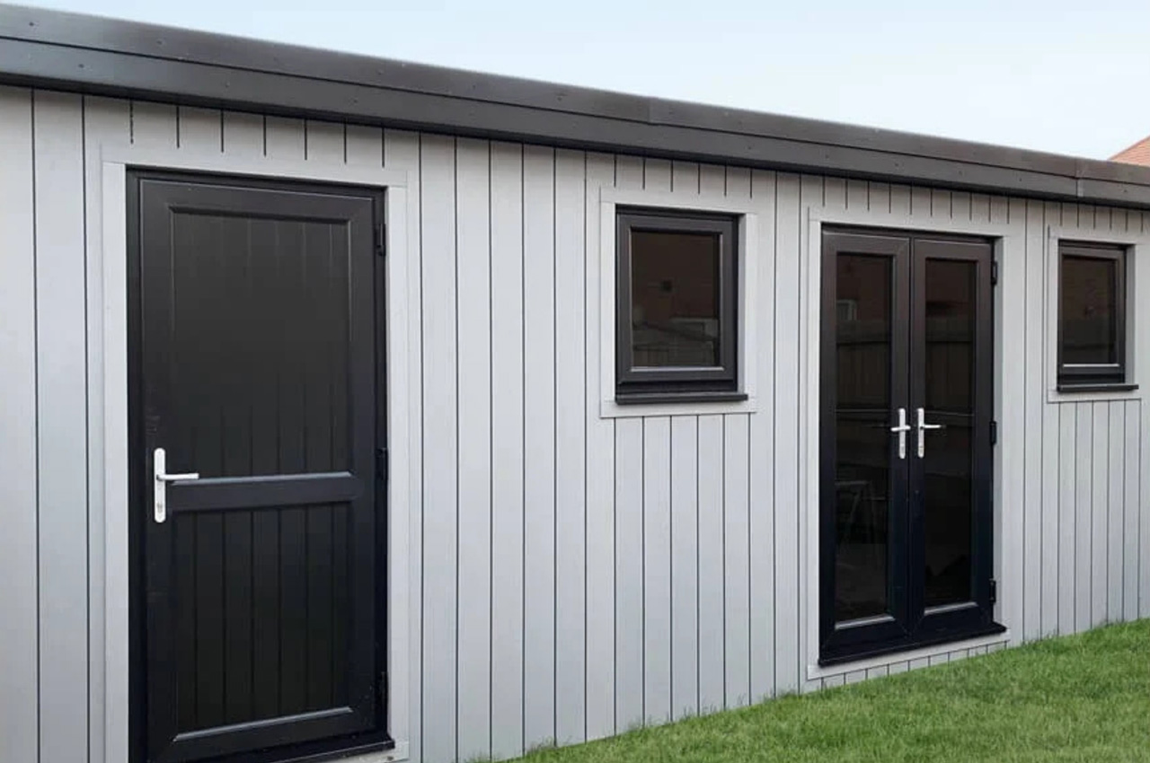 Vertically installed Stone Grey Composite Wall Cladding Boards create a stylish garden studio.