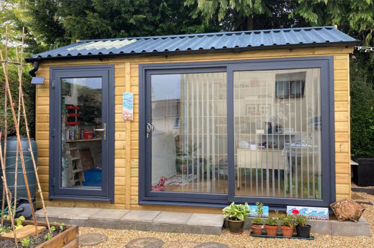 Impressive garden room completed using Cladco 34/1000 Box Profile Sheets in Anthracite colour