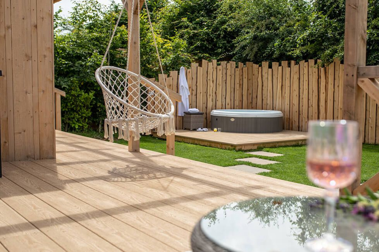 Elevate your outside living space with Cladco Nordeck Decking Boards in Cedar Wood