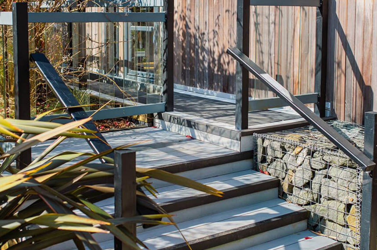 Luxury holiday retreats by Palstone Lodges use Cladco Woodgrain Effect and Original Composite Decking Boards
