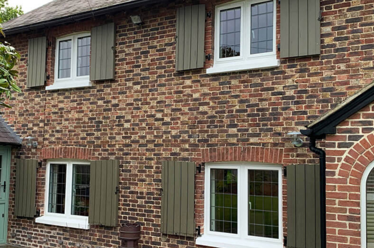 Olive Green Composite Wall Cladding Boards used as bespoke window shutters