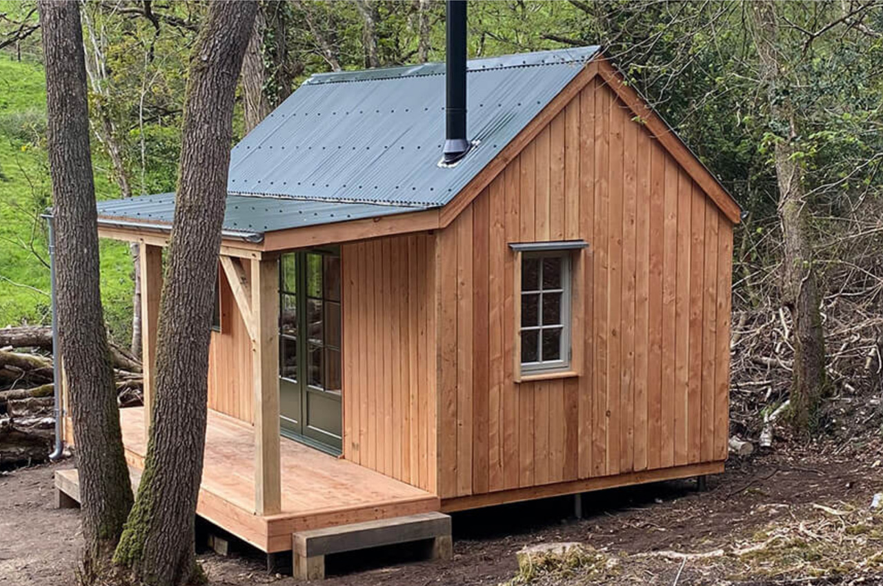Off-grid woodland cabin featuring Cladco Corrugated Roof Sheets