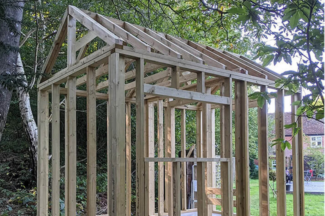 Black Corrugated Cladding Sheets adorn this garden sauna