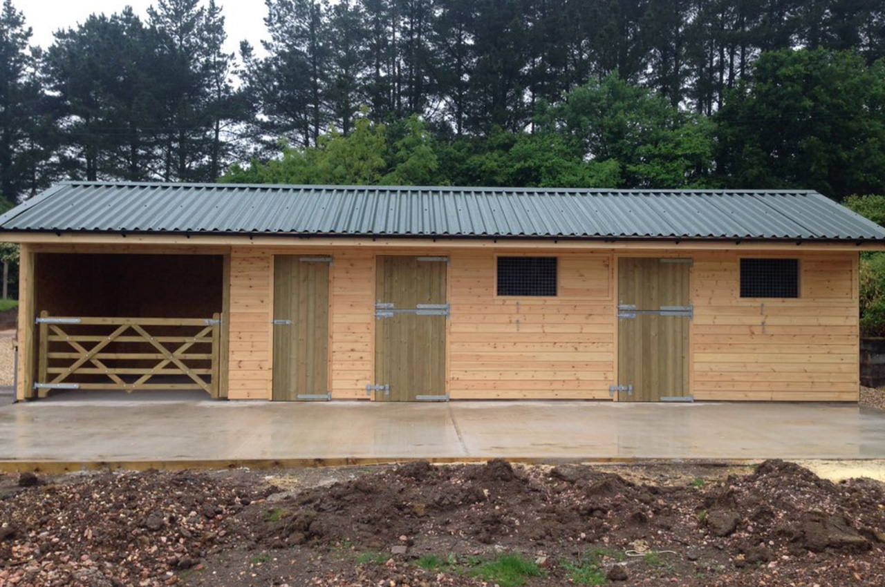 Stable Yard with added storage using Cladco Box Profile Roofing Sheets in Juniper Green