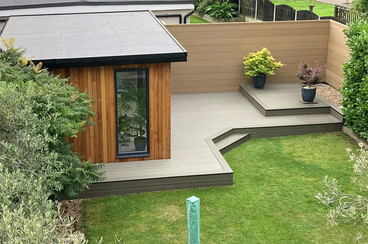 Combination of Composite Decking in Olive Green and Composite Fencing in Teak