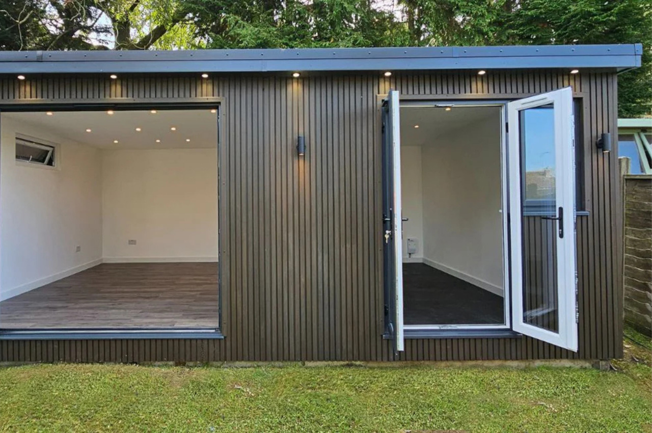 Cladco Composite Slatted Wall Panels in Walnut encase this versatile garden room.