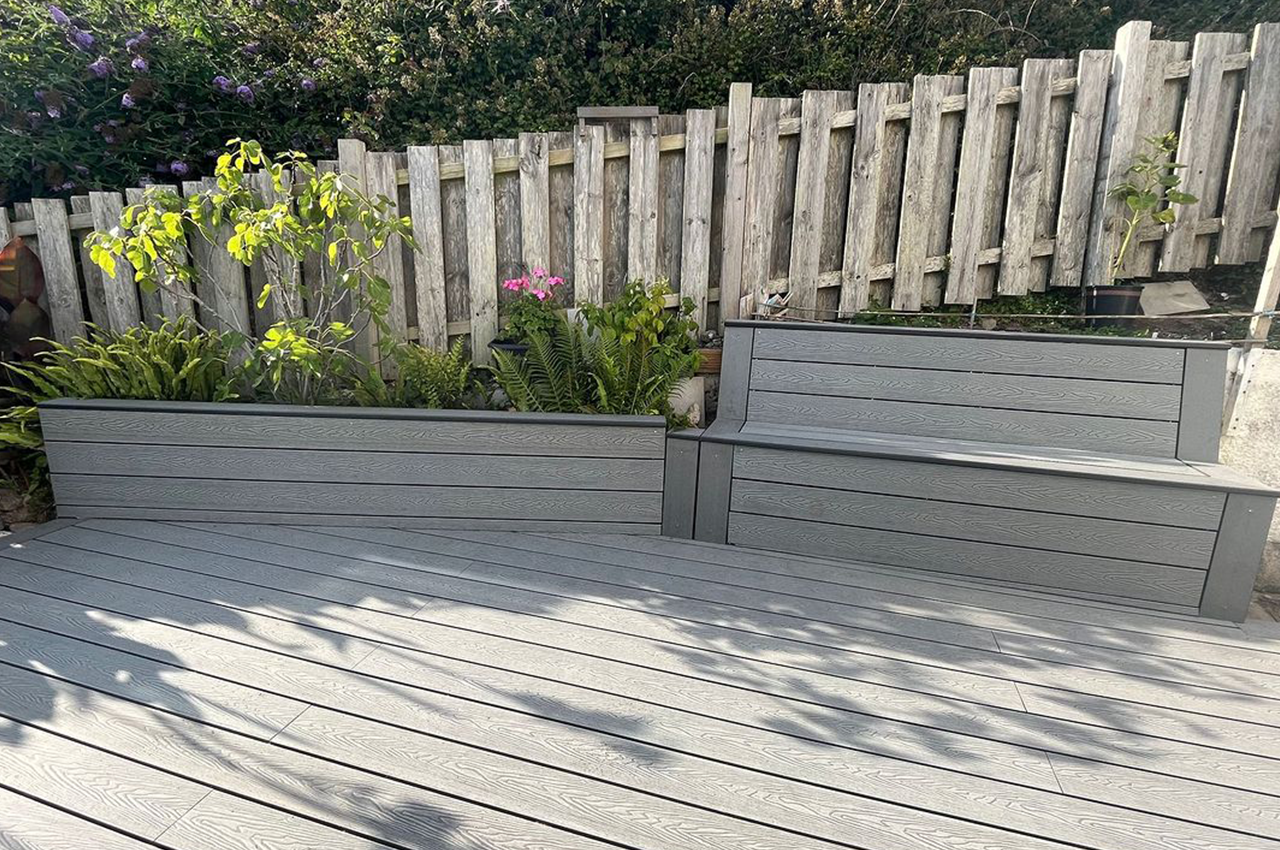 Cladco Woodgrain Composite Decking in Stone Grey for an outdoor seating area