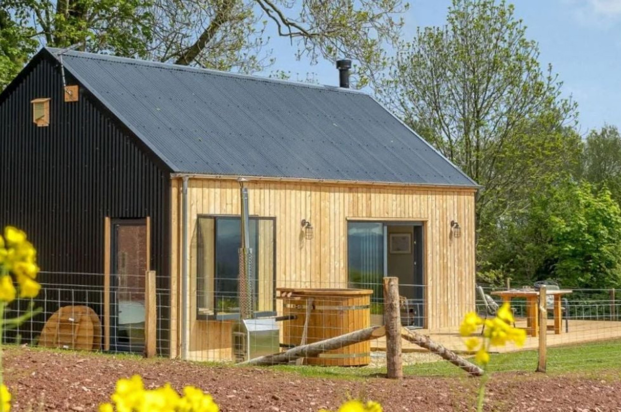 Cladco Anthracite Corrugated Roofing creates this stunning cabin.