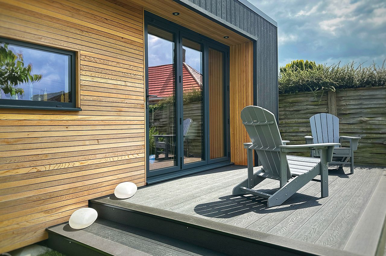 Garden studio with Cladco Composite Wall Cladding and Decking in Charcoal