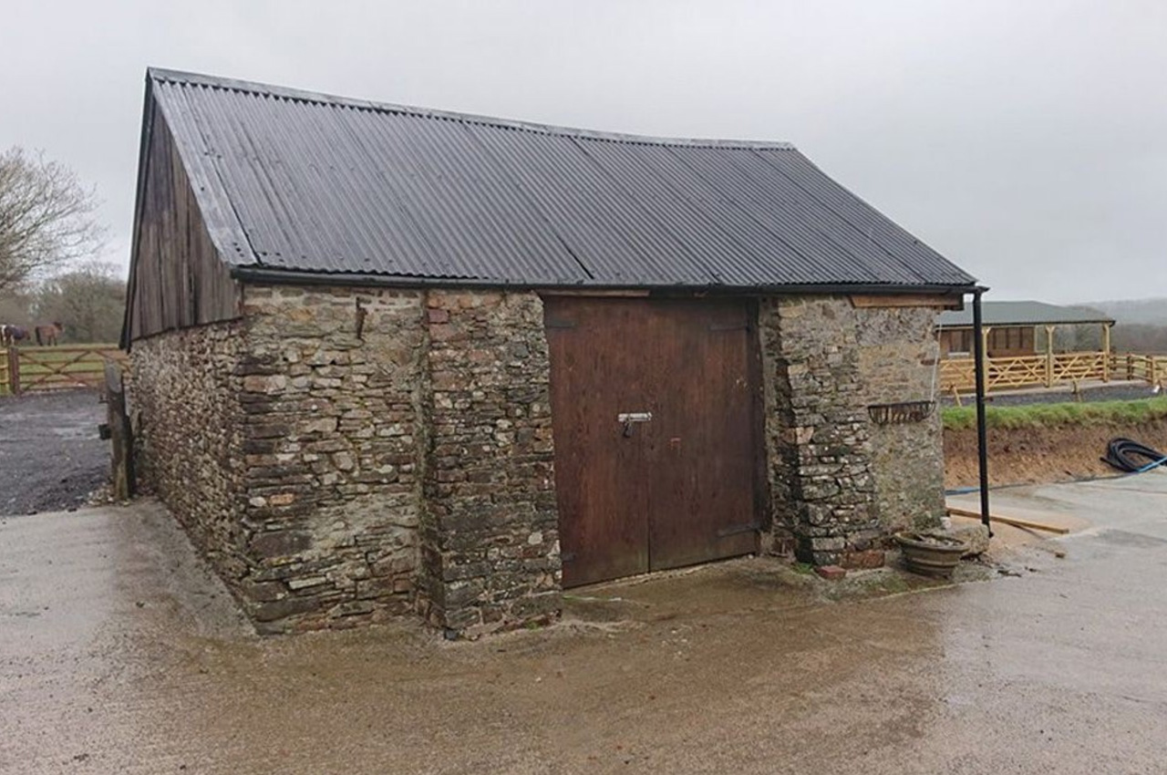 Before and after of stone barn with Anthracite PVC Corrugated Sheeting