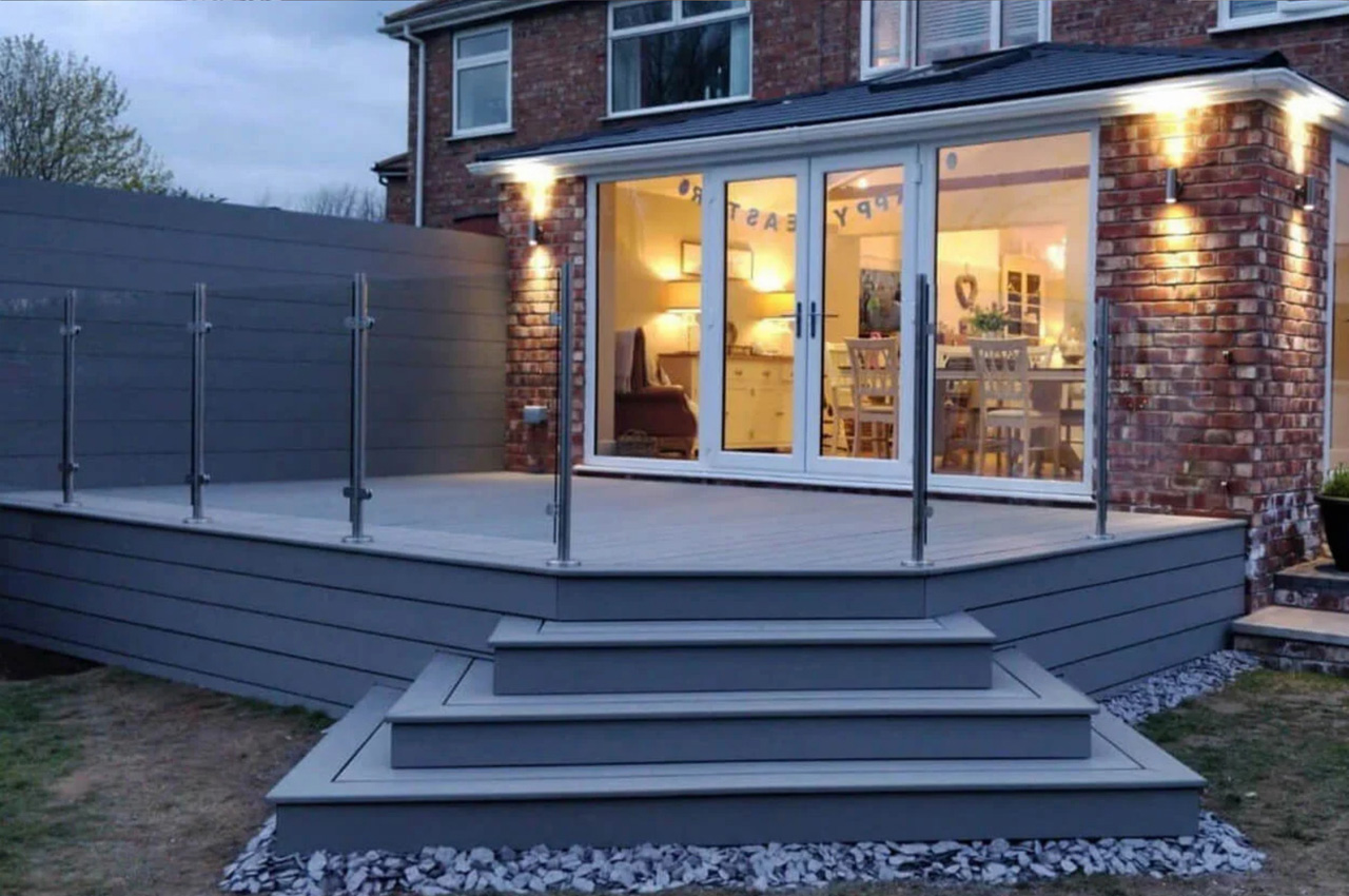 Cladco Light Grey Decking Boards with steps and glass balustrade.