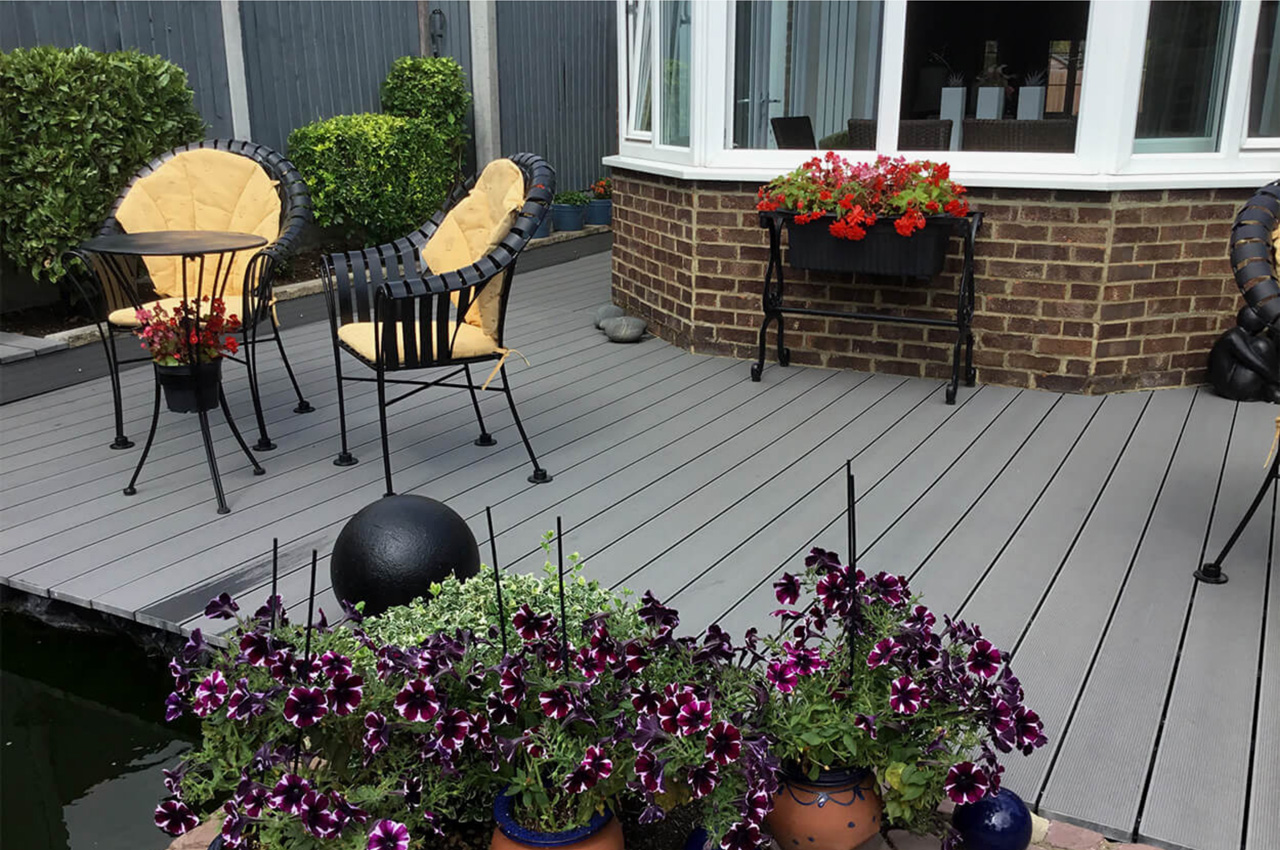 Cladco Composite Decking Boards in Stone Grey with Floral & Stone Boarder