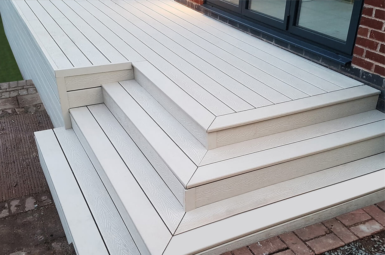 Raised ivory woodgrain decking area with a bullnose edge.