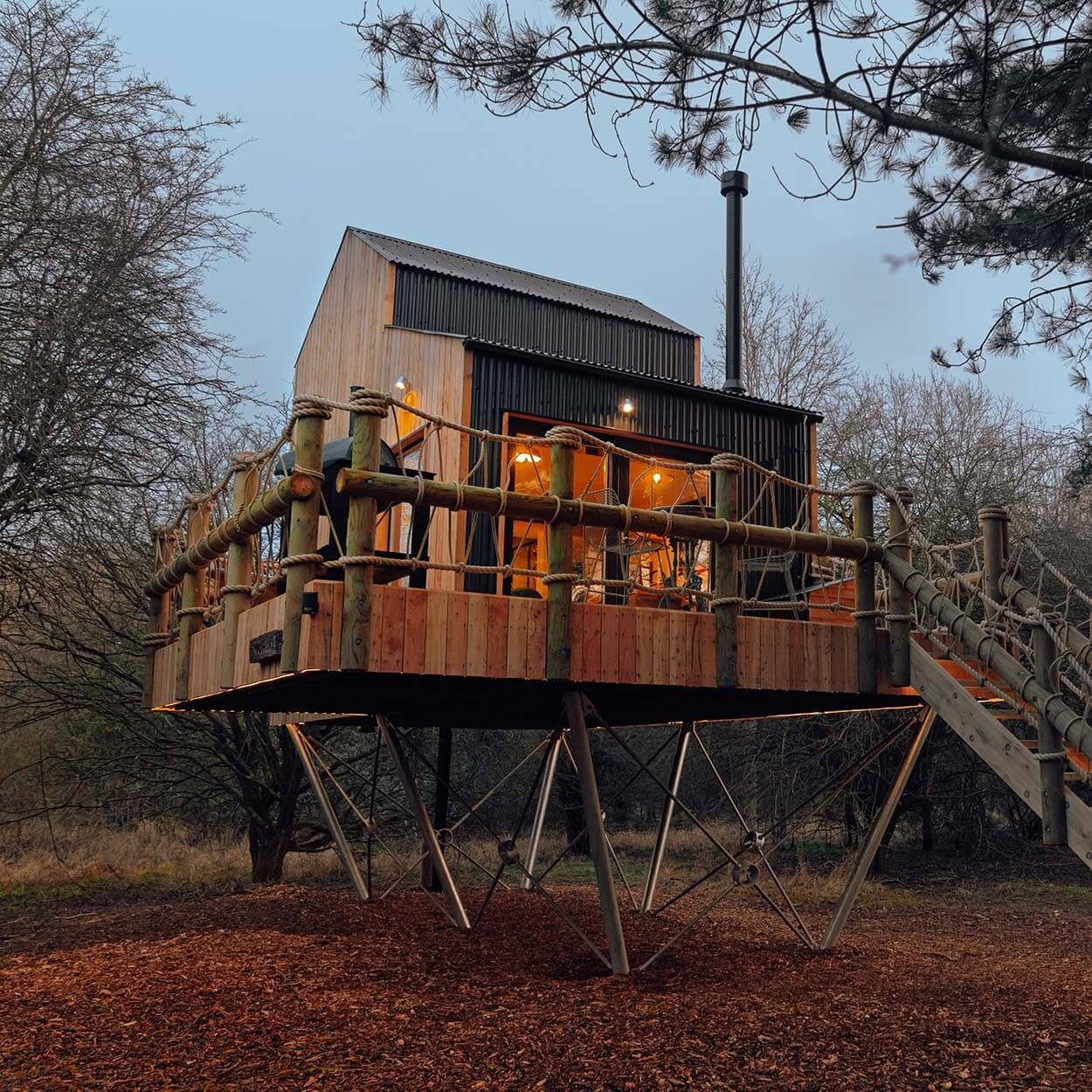 Eco-Friendly Treehouse with Corrugated Roofing and Cladding – The Wilding Airfield