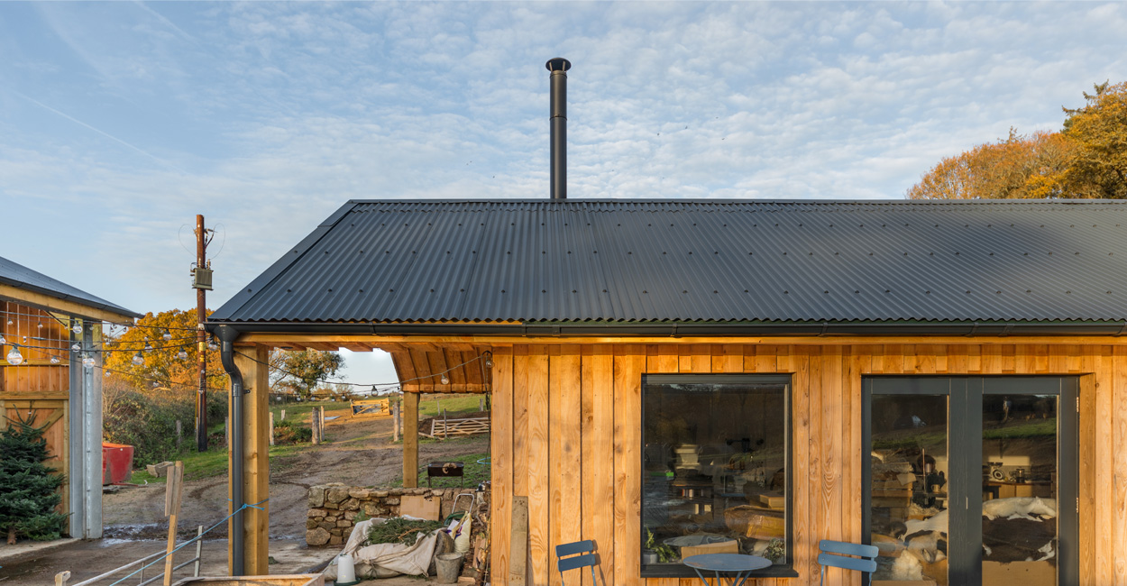 The Dartmoor Shepherd's woolshed under Cladco corrugated steel roofing, used for processing Dartmoor sheep wool products