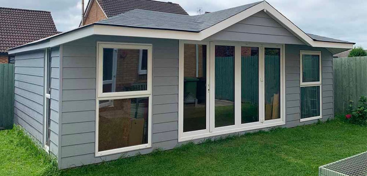 Cladco Fibre Cement Wall Cladding is available in several colours including Blue as pictured, for a contemporary finish. Fibre Cement Boards used as cladding on a domestic garden room