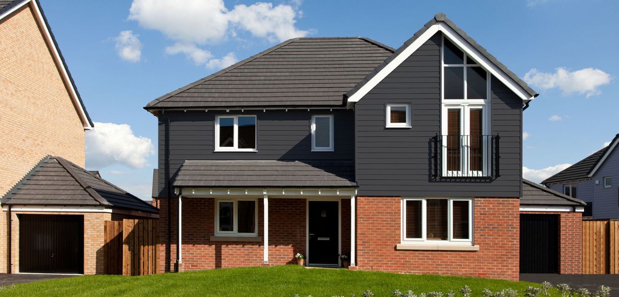 This stunning standalone detached home has used our Fibre Cement Wall Cladding Boards in Granite to add depth and Character to the outside of the build. Light Grey coloured Fibre Cement Boards used on a small annex building