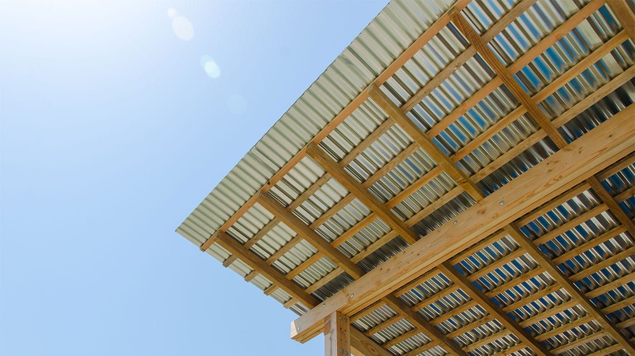 Underside view of Cladco 13/3 corrugated steel roofing sheets installed on timber framework at Holly Water Cabin by Out of the Valley