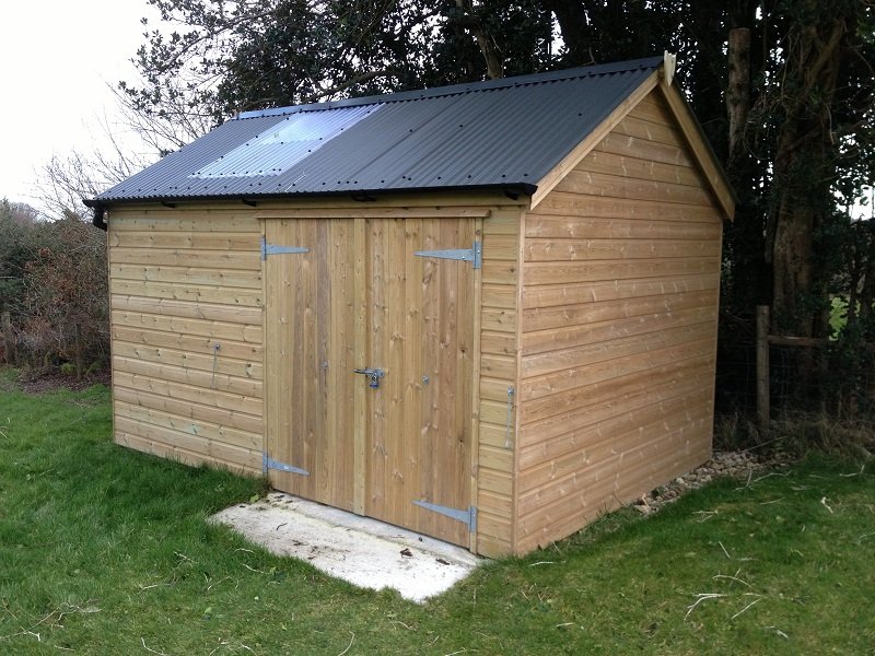 Handcrafted timber shed by Shields Buildings showcasing Cladco black corrugated steel roofing in North Tawton, Devon