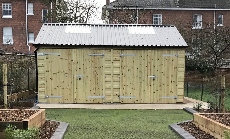 Custom timber workshop constructed by Shields Buildings with Cladco black corrugated steel roofing in North Tawton, Devon