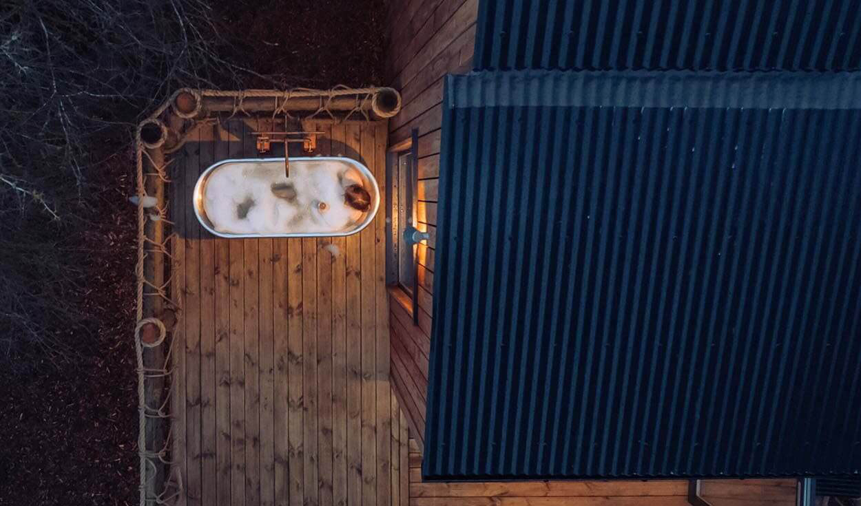 Close-up of Cladco black PVC Plastisol coated corrugated steel roofing on Two Pines treehouse