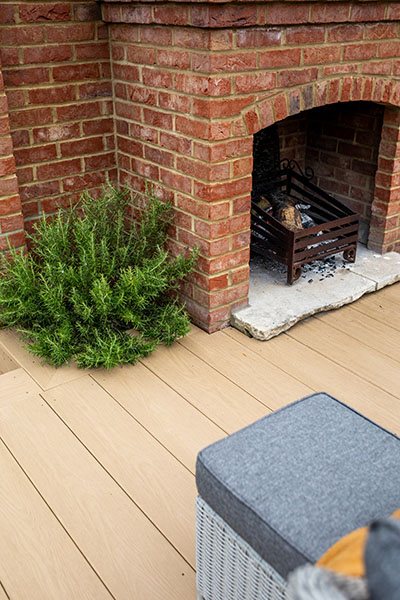 Outdoor fireplace situated on Cladco Cedar Wood PVC decking at Oakwood West Holidays