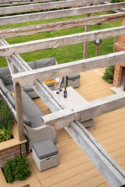 Outdoor seating area featuring Cladco Nordeck Cedar Wood PVC decking at Oakwood West Holidays