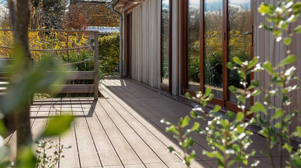 Cladco Composite Decking extending outdoor space of luxury timber-clad cabin at Palstone Lodges