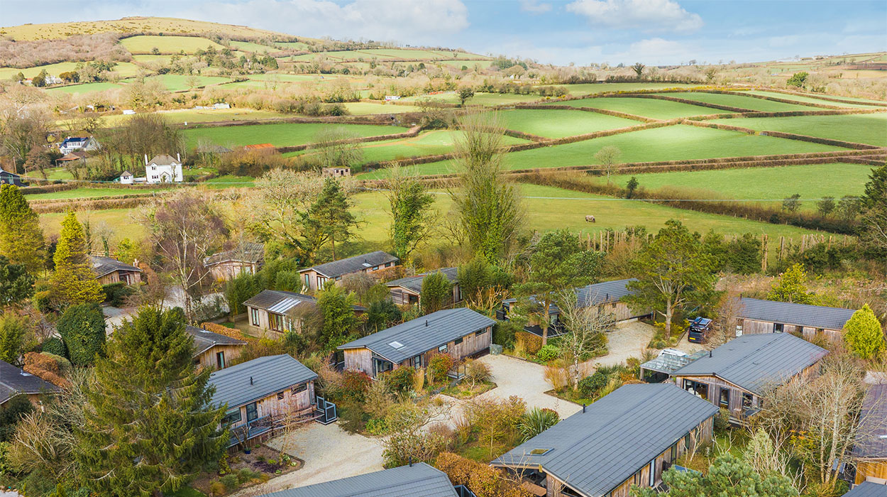 Group of countryside holiday cabins with Cladco Composite Decking overlooking Dartmoor National Park