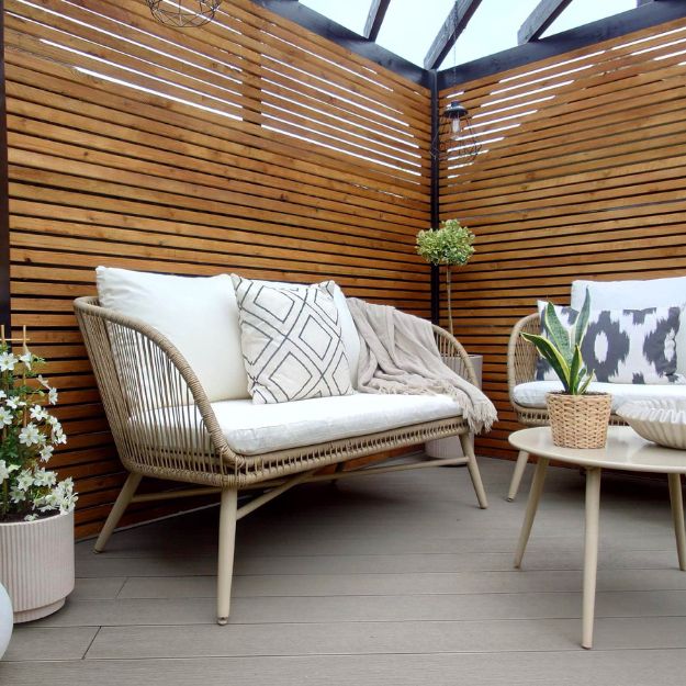 Corner of a small garden made useable with composite decking