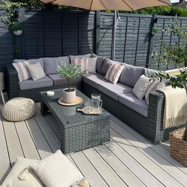 Ivory decking creating a small, garden snug