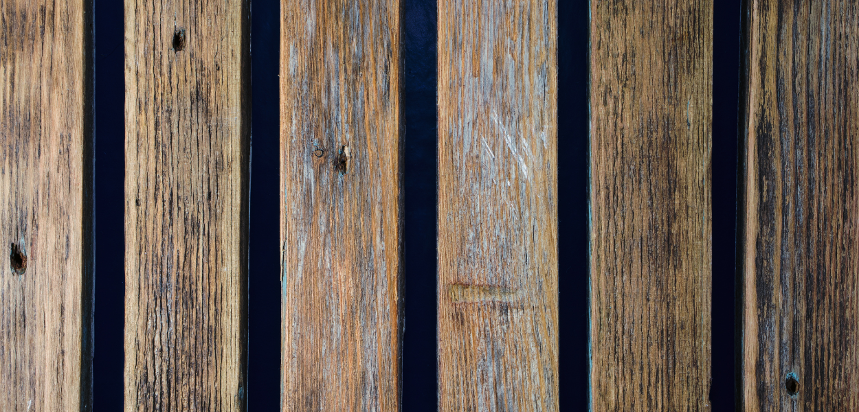 Slim, wooden batons are applied over the joints of wider wooden boards to creat a board-and-batten effect Slim, wooden batons are applied over the joints of wider wooden boards to creat a board-and-batten effect