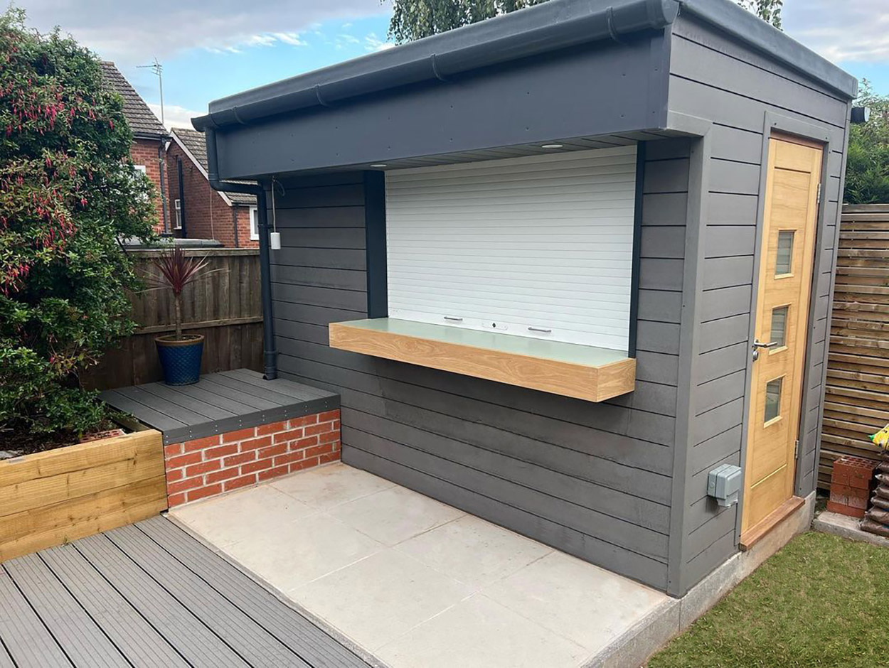 A garden bar that has been finished with Composite Wall Cladding in Stone Grey colour.