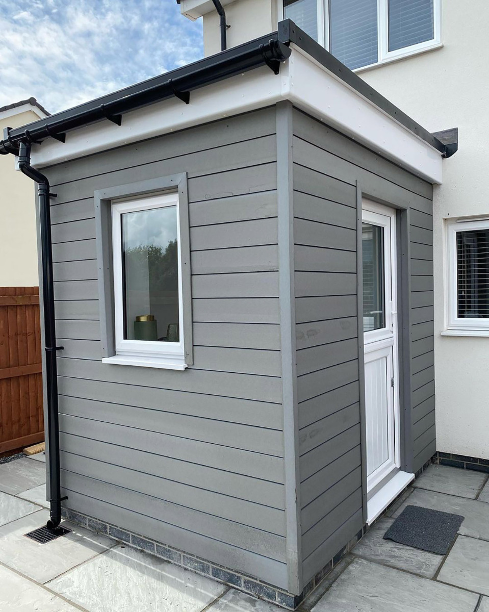 Stone Grey Composite Cladding Boards fitted on a small, square external home entrance.