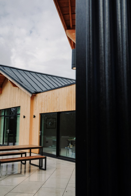Another angle of the Sanctuary Sleeps Black Corrugated Cladding lodges.