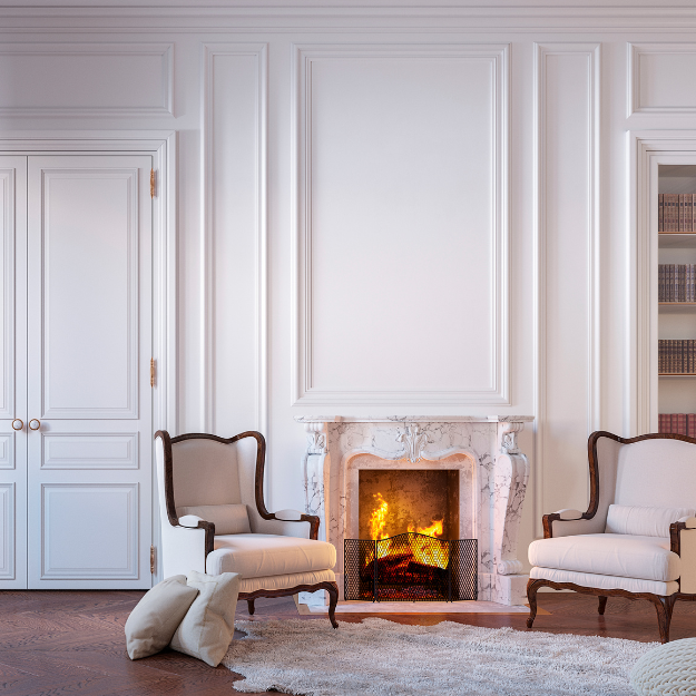A living room with a modern take on victorian-style wall panelling using white paint A living room with a modern take on victorian-style wall panelling using white paint