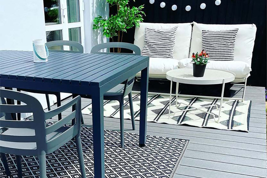 Small garden patio area with grey composite decking